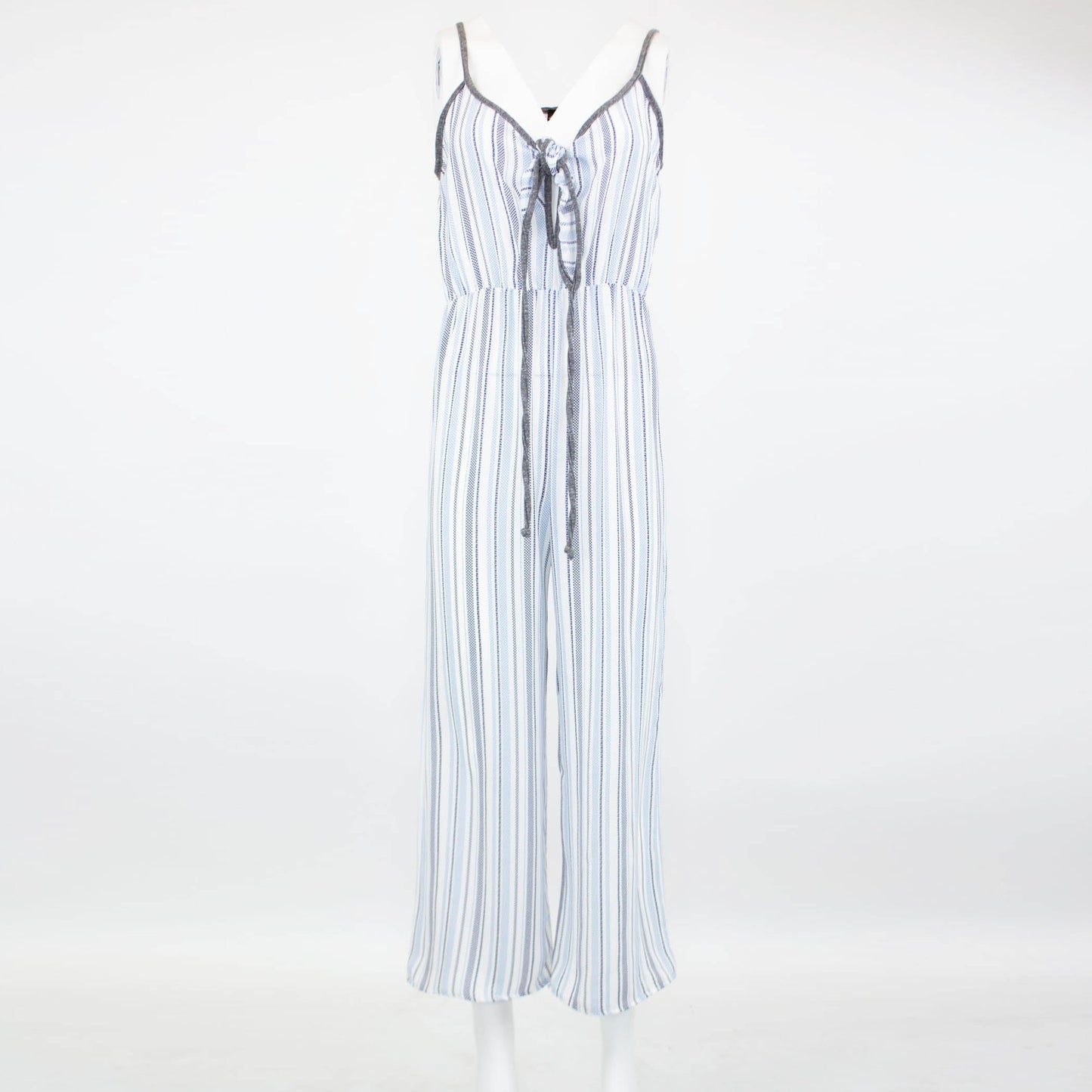 Someone is wearing the Stylespect Front Tie Cropped Jumpsuit in blue with stripes and wide legs, paired with beige pointed heels.