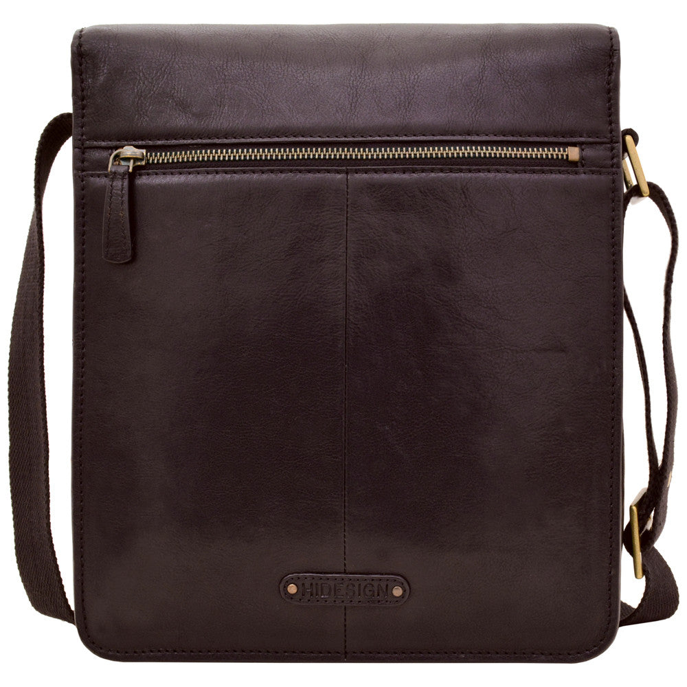 Hidesigns Aiden Genuine Leather Medium Crossbody is a dark brown shoulder bag featuring a wide strap and rectangular brass buckle.