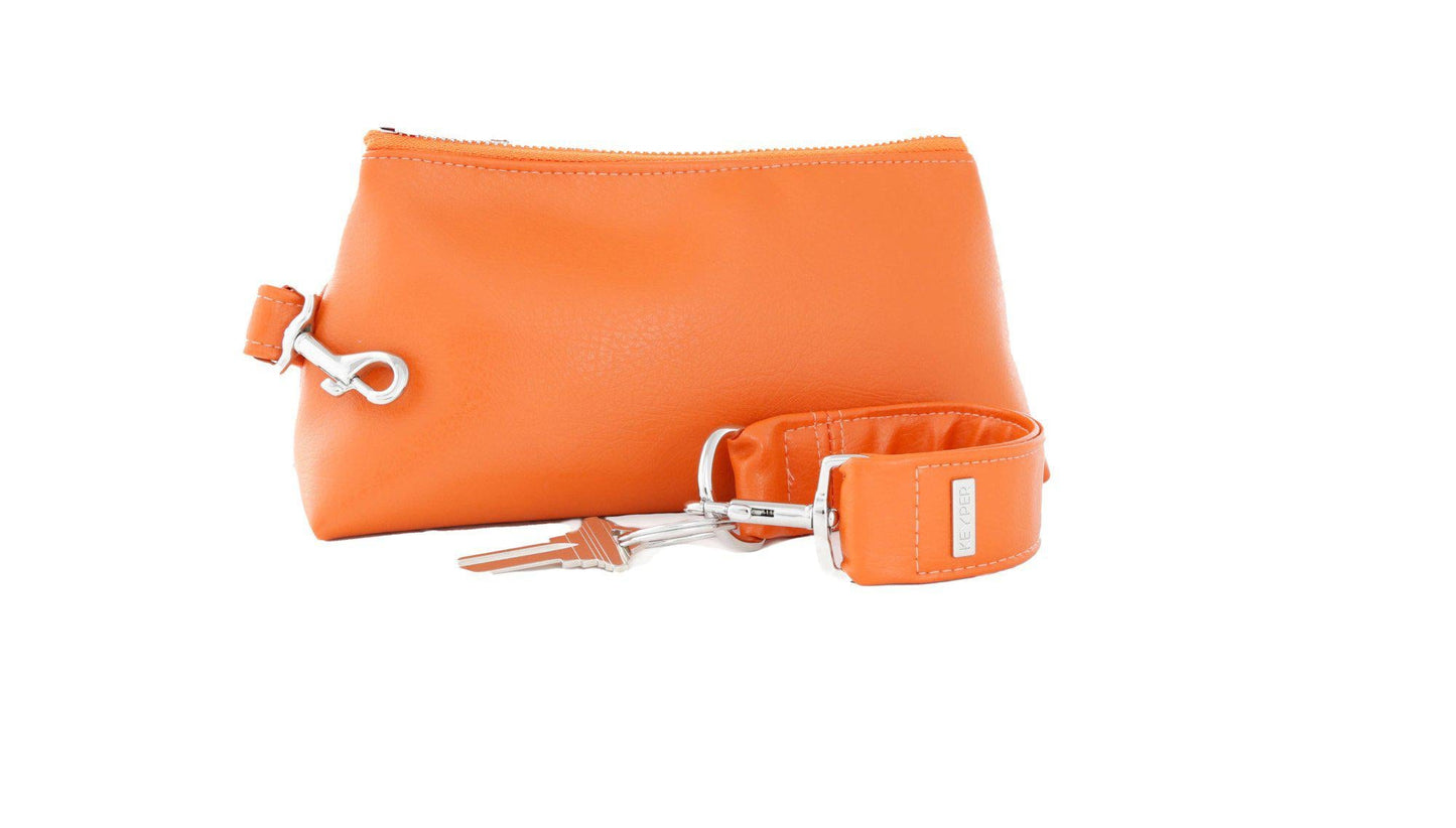 The KEYPER Persimmon Vegan Leather 2-Piece Wristlet Set features a clutch bag with a gold zipper, detachable strap, and small gold keychain.