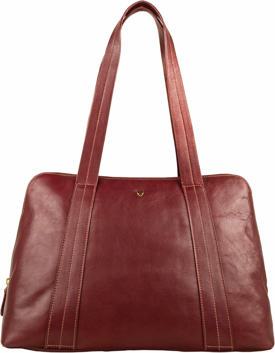 The Hidesign Cerys Leather Multi-Compartment Tote is a brown handbag featuring two straps and a minimal stitching design.