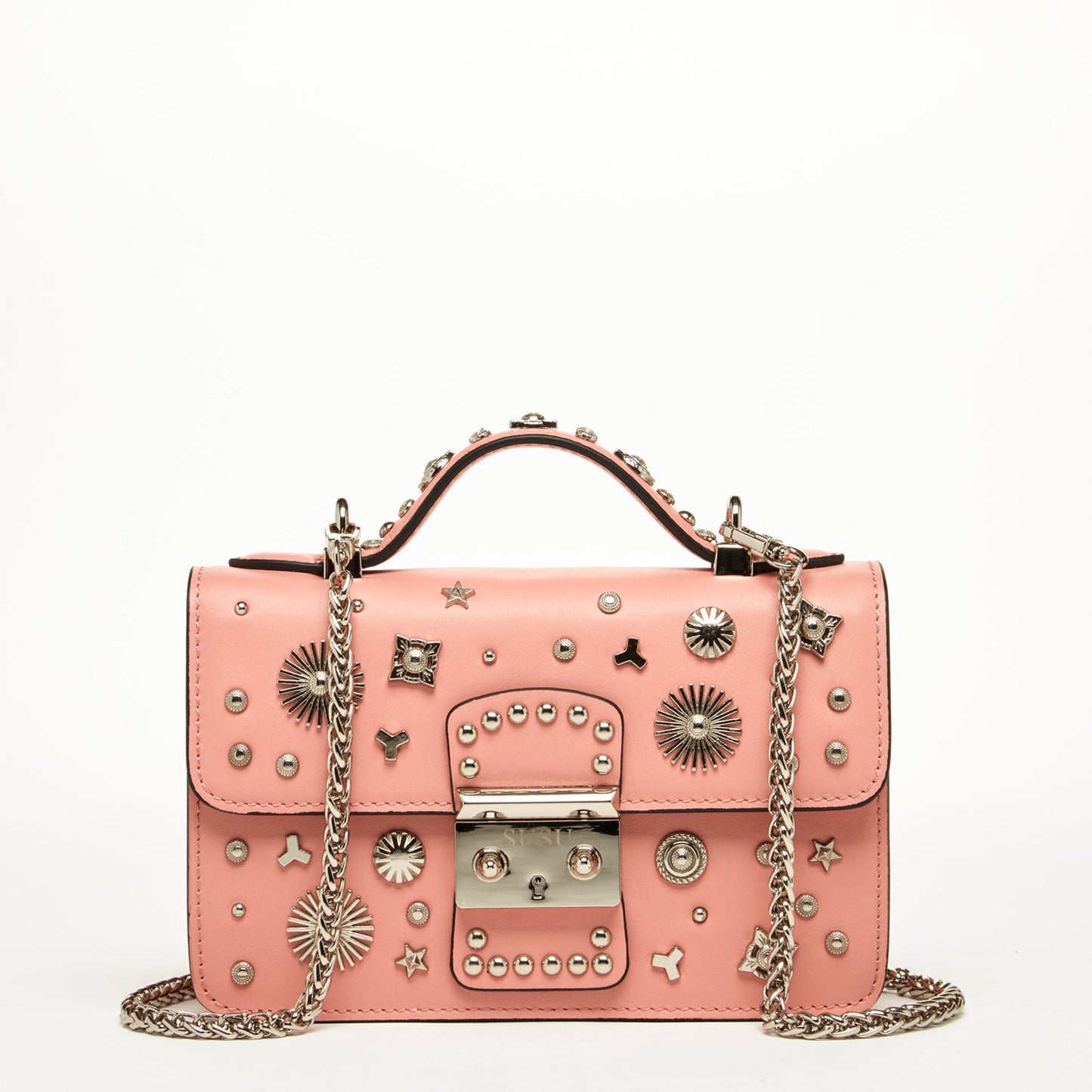 The Hollywood Leather Crossbody Bag Pale Pink by SUSU features metal studs, decorative patterns, a chain strap, and a buckle closure.