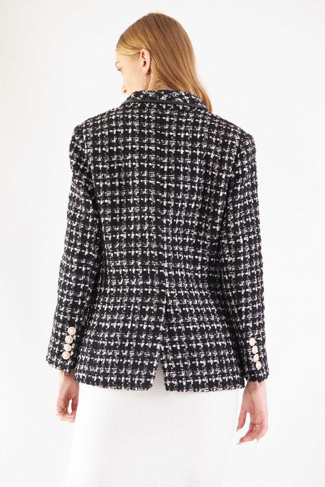 Close-up of Le Réussi®s Power Woman Black & White Tweed Checkers Jacket featuring decorative pearl buttons.