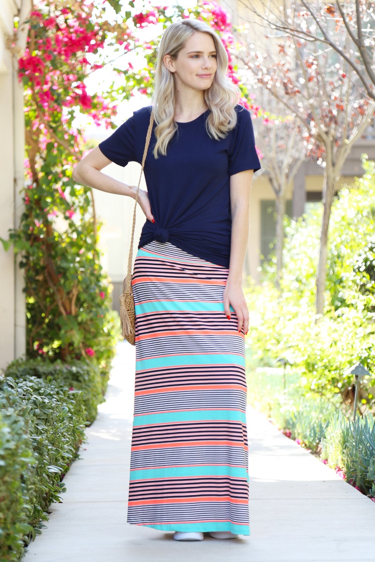 A person wearing a Simple Patterned Maxi Skirt by Riah Fashion and open-toed sandals.