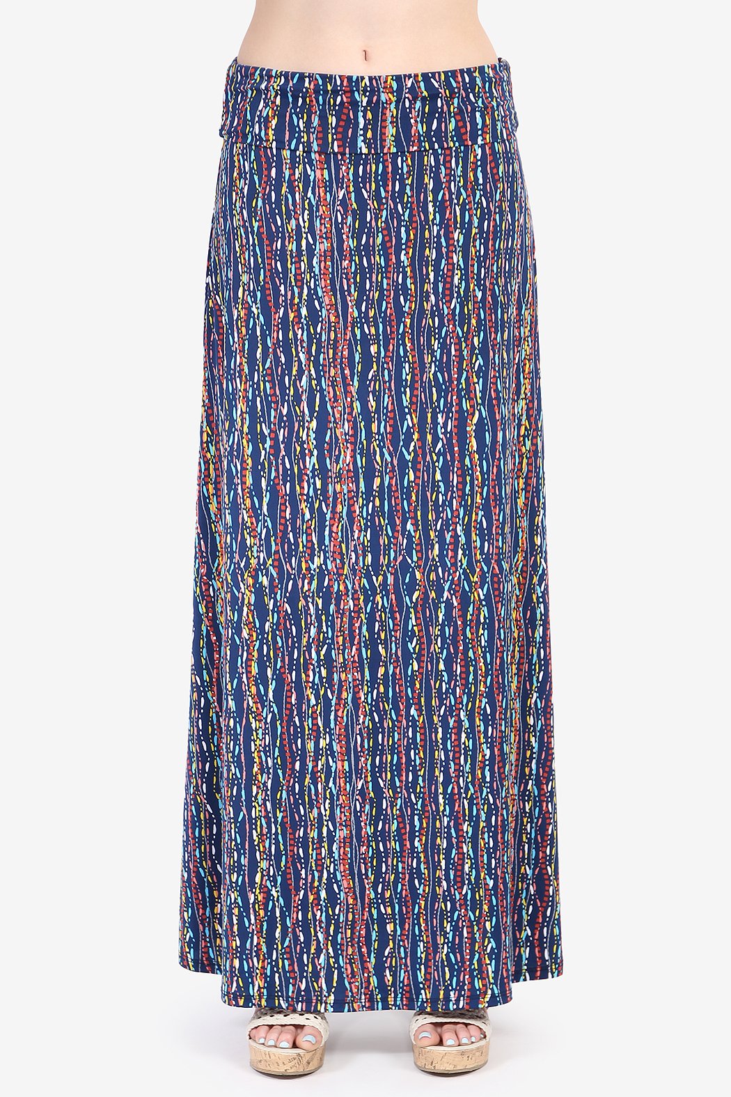 A person wearing a Simple Patterned Maxi Skirt by Riah Fashion and open-toed sandals.