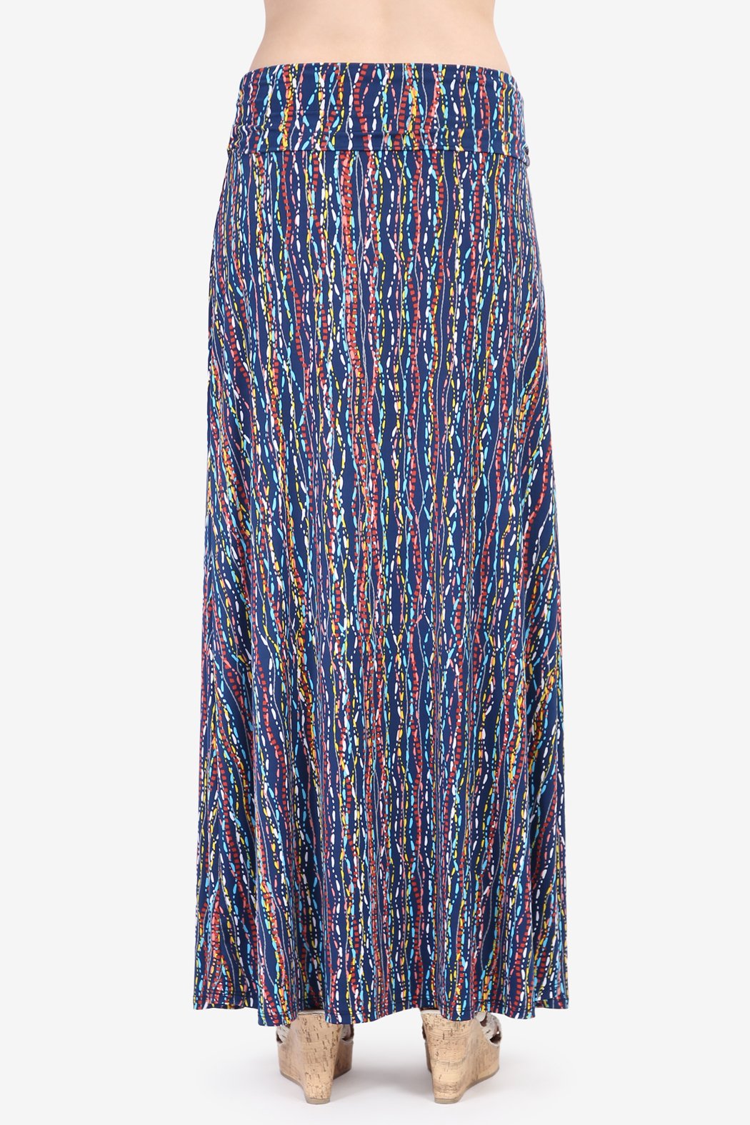 A person wearing a Simple Patterned Maxi Skirt by Riah Fashion and open-toed sandals.