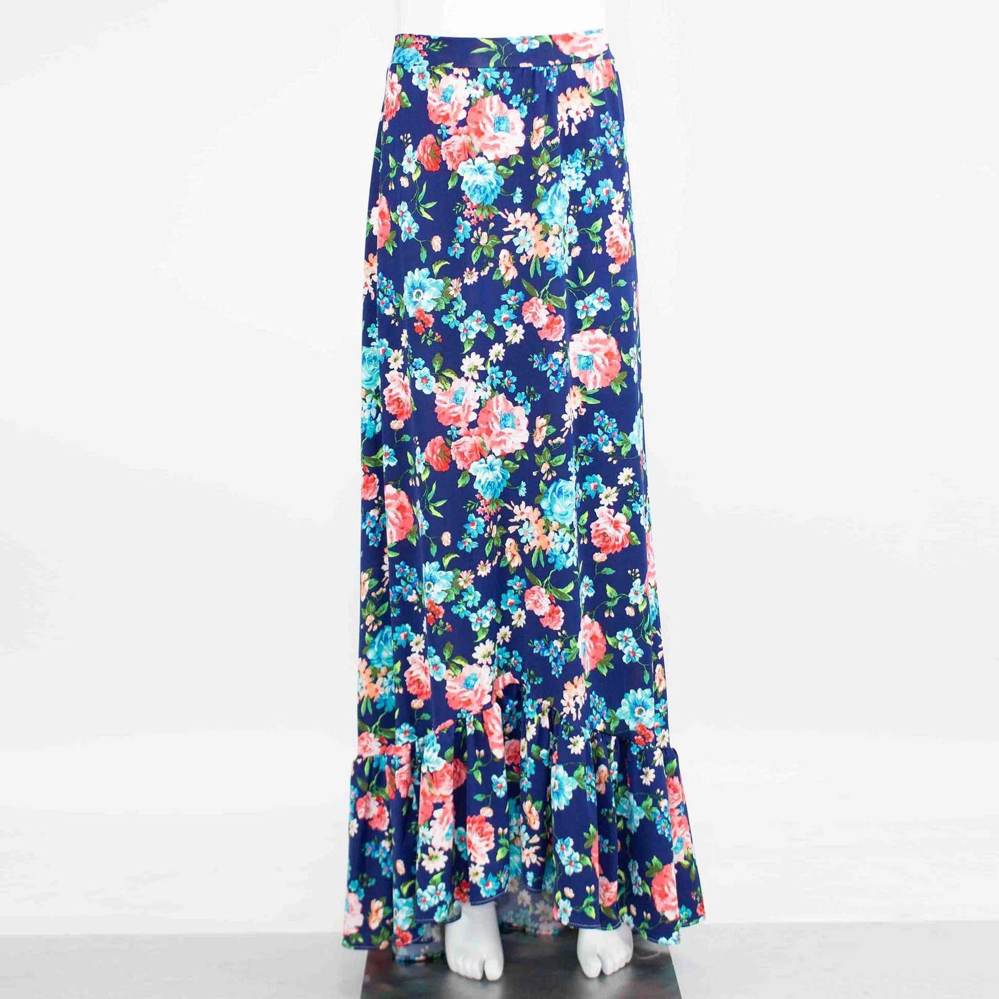 A Flared Bottom Flower Maxi Skirt by Stylespect, featuring a blue floral design and a ruffled hem, displayed on a mannequin.