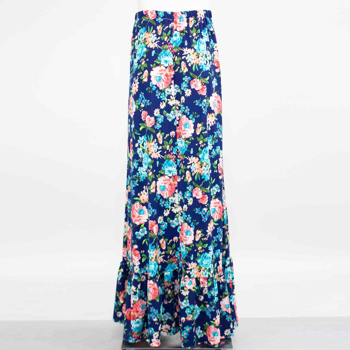 A Flared Bottom Flower Maxi Skirt by Stylespect, featuring a blue floral design and a ruffled hem, displayed on a mannequin.