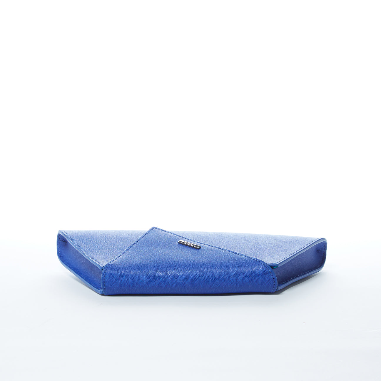 A SUSU Angelica Cobalt Blue Leather Clutch Bag featuring a triangular flap design and a silver chain strap.