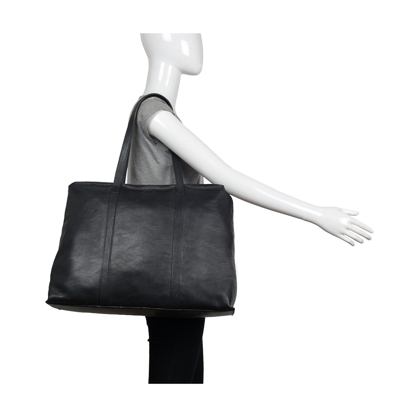 The Nancy Large Leather Tote by Hidesign is a sleek black leather bag with two handles.