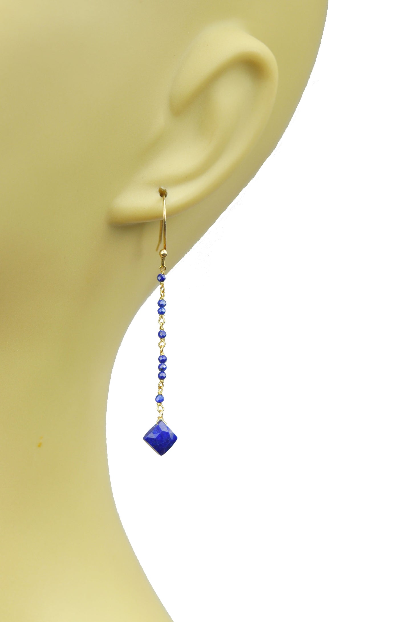 Gena Myints Lapis Lazuli Linear Vermeil Earrings feature gold wire with dangling blue beads and square blue gemstones.