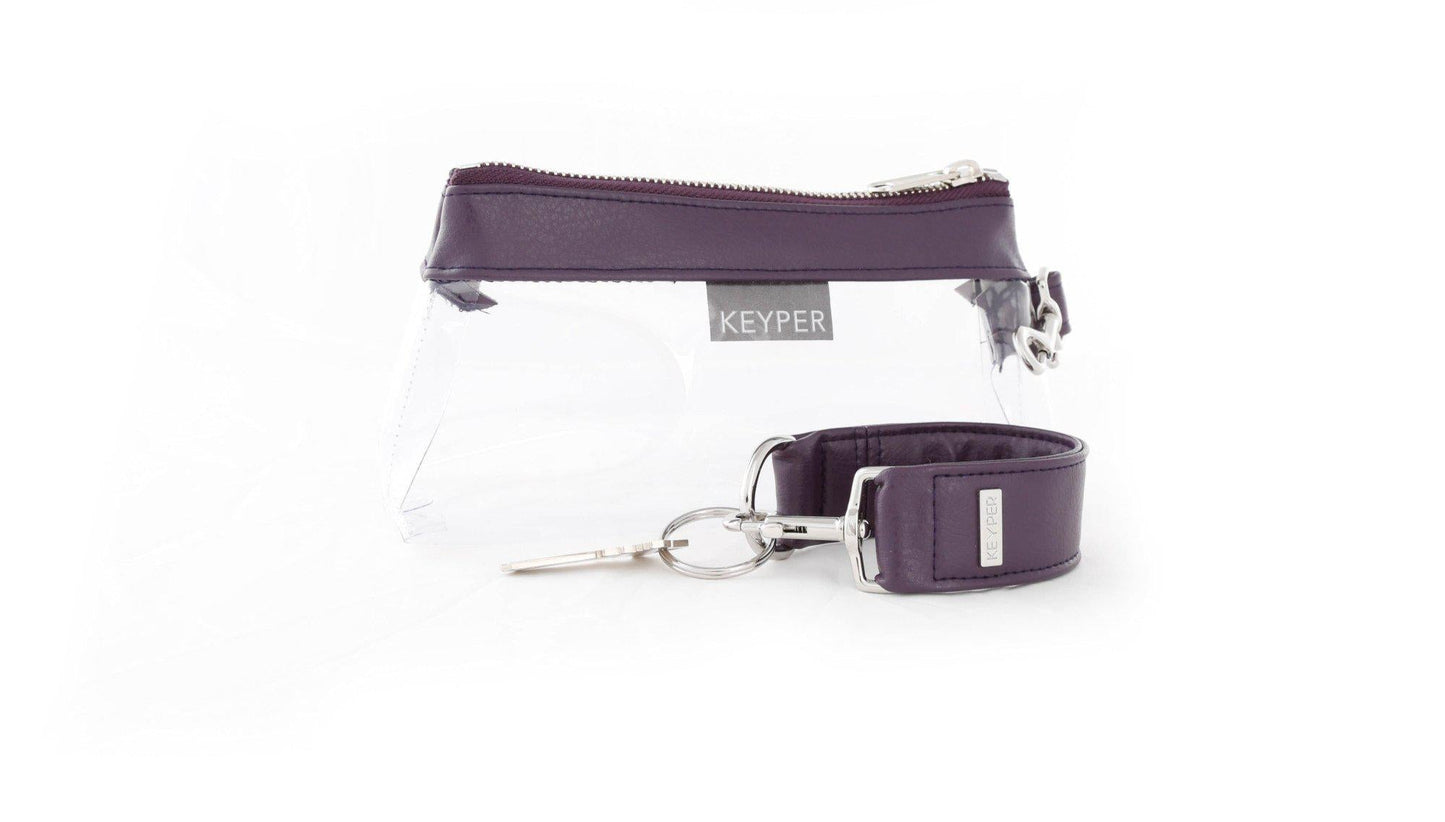 The Pretty Purple Vegan Leather 2-Piece WRISTLET SET by KEYPER features a wristlet with a zipper and gold accents, plus a detachable strap, and comes next to keys on a silver keyring.