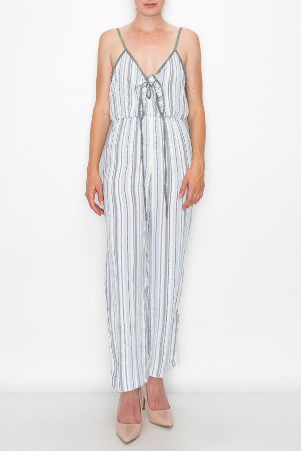 Someone is wearing the Stylespect Front Tie Cropped Jumpsuit in blue with stripes and wide legs, paired with beige pointed heels.
