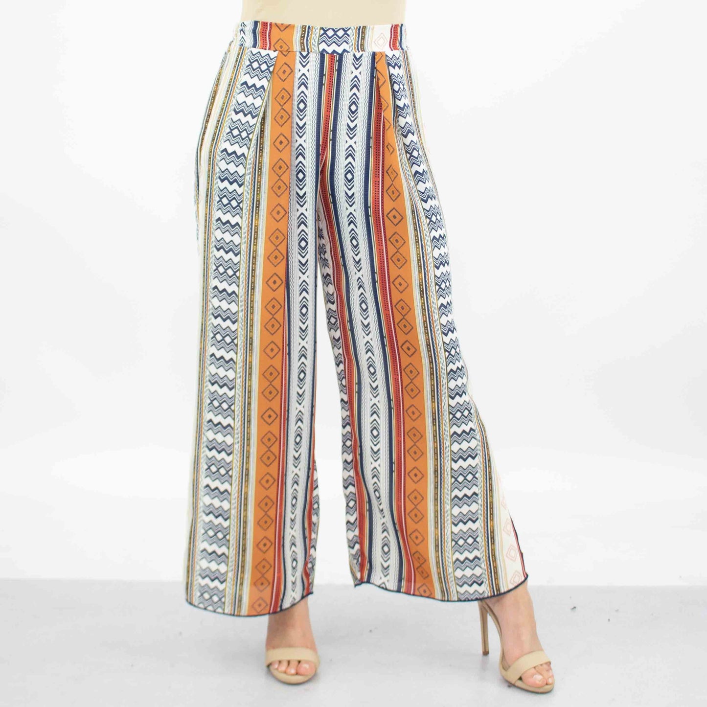 A person dressed in Stylespects Side Slit Wide Leg Cropped Pants and beige heels stands against a white background.