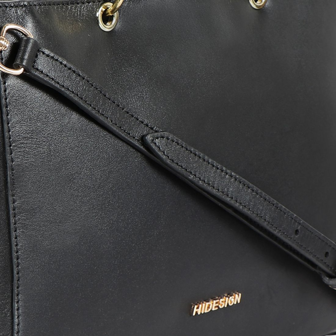 The Hidesign Life New Womens Leather Handbag is a red satchel with dual top handles, a detachable shoulder strap, gold-tone hardware, and the brand logo on the front.