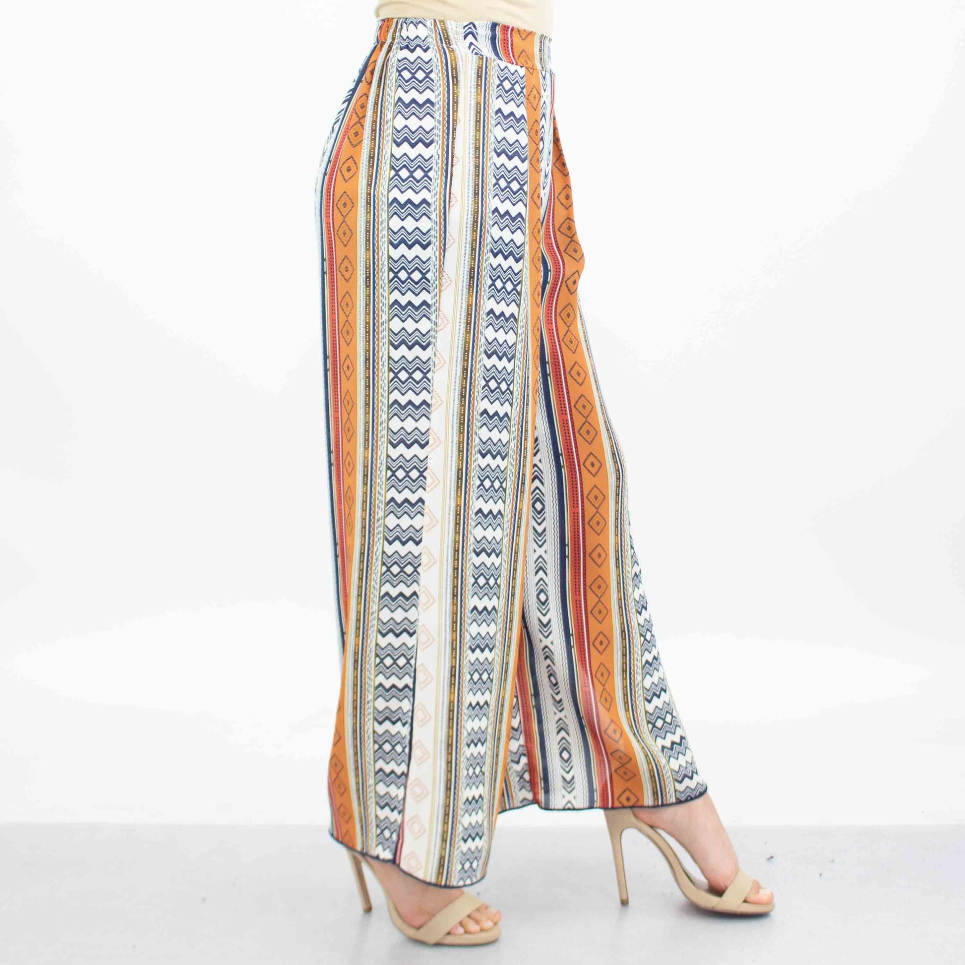 A person dressed in Stylespects Side Slit Wide Leg Cropped Pants and beige heels stands against a white background.