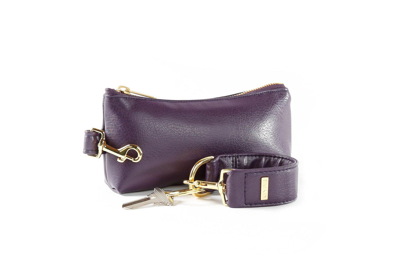 The Pretty Purple Vegan Leather 2-Piece WRISTLET SET by KEYPER features a wristlet with a zipper and gold accents, plus a detachable strap, and comes next to keys on a silver keyring.