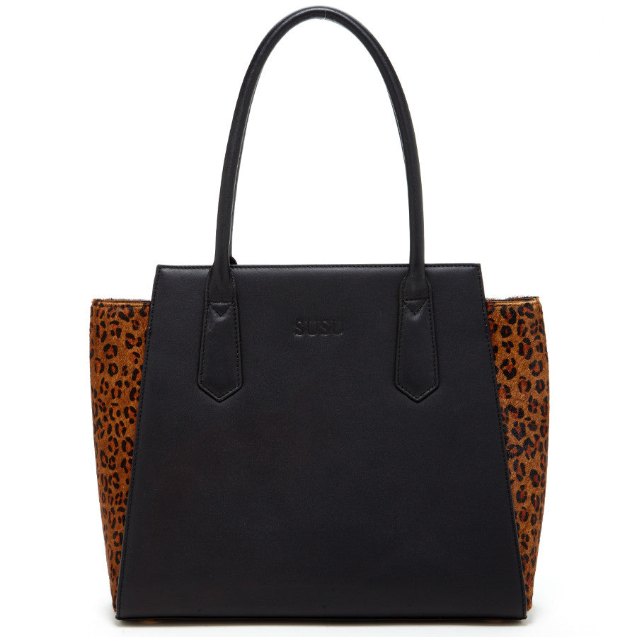 The SUSU Jody Black Leather Tote Bag features a stylish leopard print design and two handles.