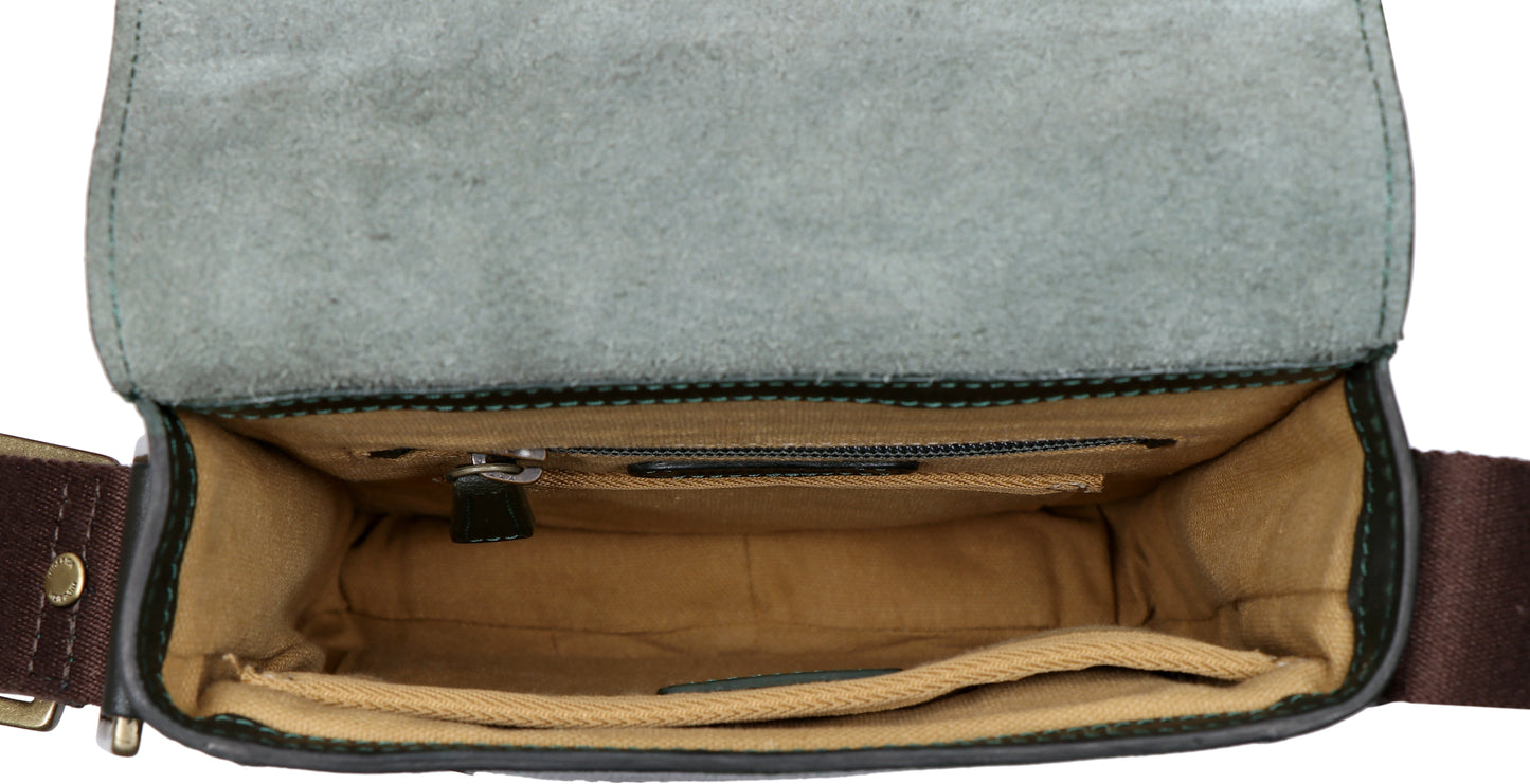 The Aiden Genuine Leather Mini Crossbody by Hidesign is a brown leather shoulder bag featuring a flap cover and an adjustable fabric strap with a brass buckle.