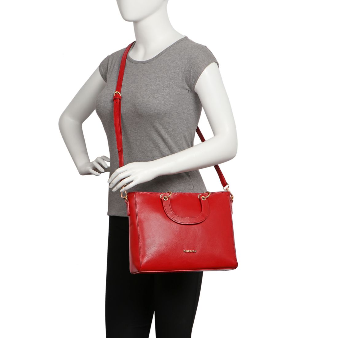 The Hidesign Life New Womens Leather Handbag is a red satchel with dual top handles, a detachable shoulder strap, gold-tone hardware, and the brand logo on the front.