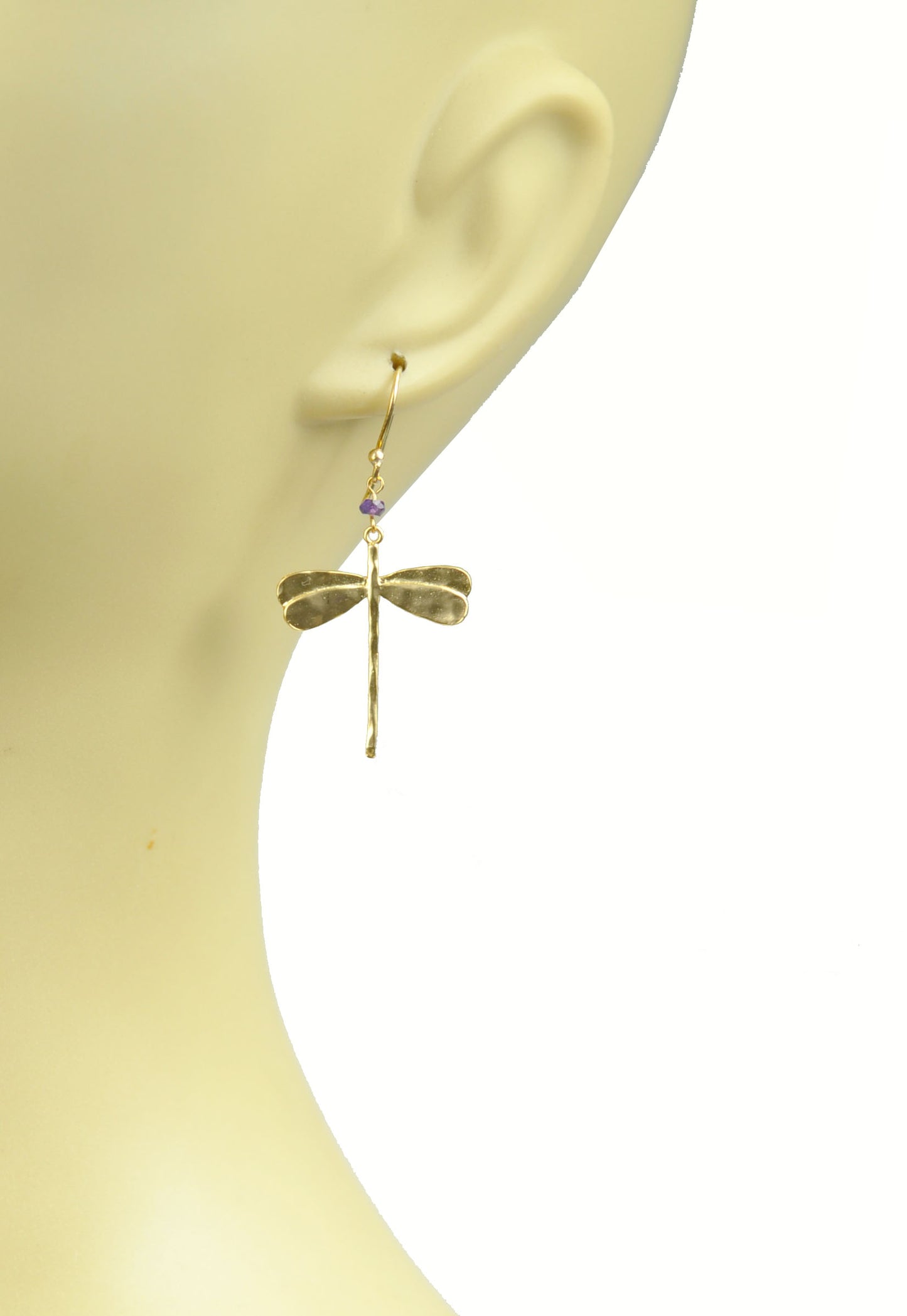 Gena Myint Dragonfly Amethyst Earrings, featuring a gold dragonfly shape adorned with small purple beads.