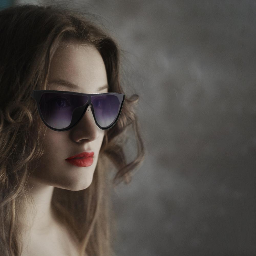 Cramilo Eyewears TOULOUSE Womens Round Polarized Fashion Sunglasses feature large black lenses and a sleek frame, displayed on a white background.