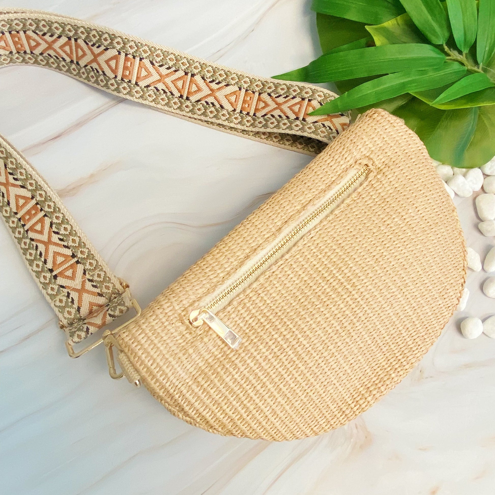 Four Bahama Breeze Fit All Sling Bags by Ellison + Young in pink, black, beige, and green with unique patterned straps are displayed on a white surface.