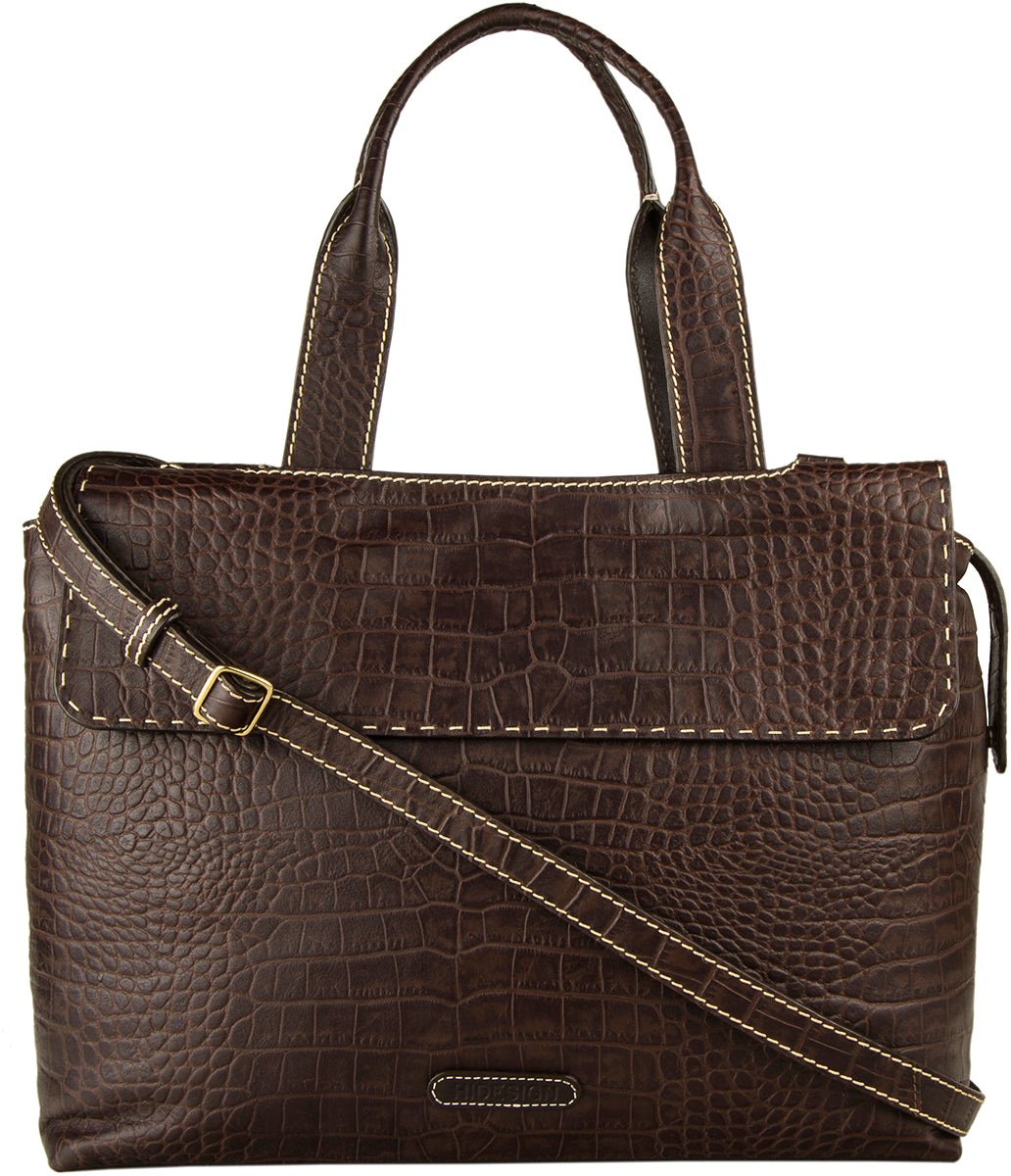 The Hidesign Womens Leather Laptop Work Bag is a brown leather handbag with a crocodile pattern, featuring a flap closure, double handles, and an adjustable shoulder strap.