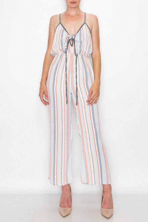 A person wearing the Stylespect Front Tie Cropped Jumpsuit in orange and beige heels stands against a plain white background.