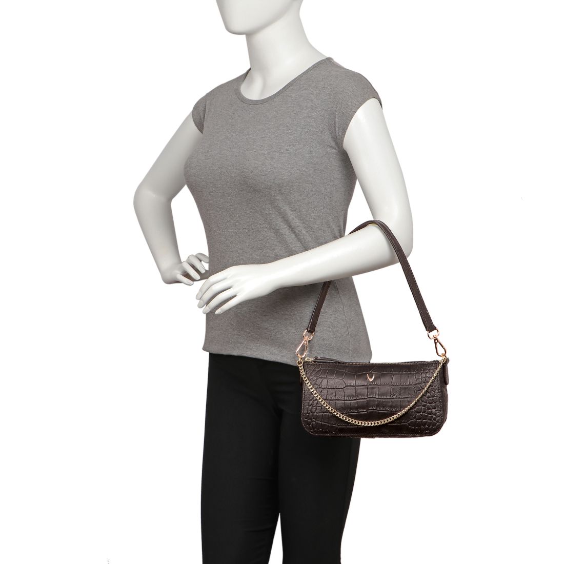Hidesign Valerie black crocodile-textured handbag featuring a gold chain accent and single shoulder strap against a white background.