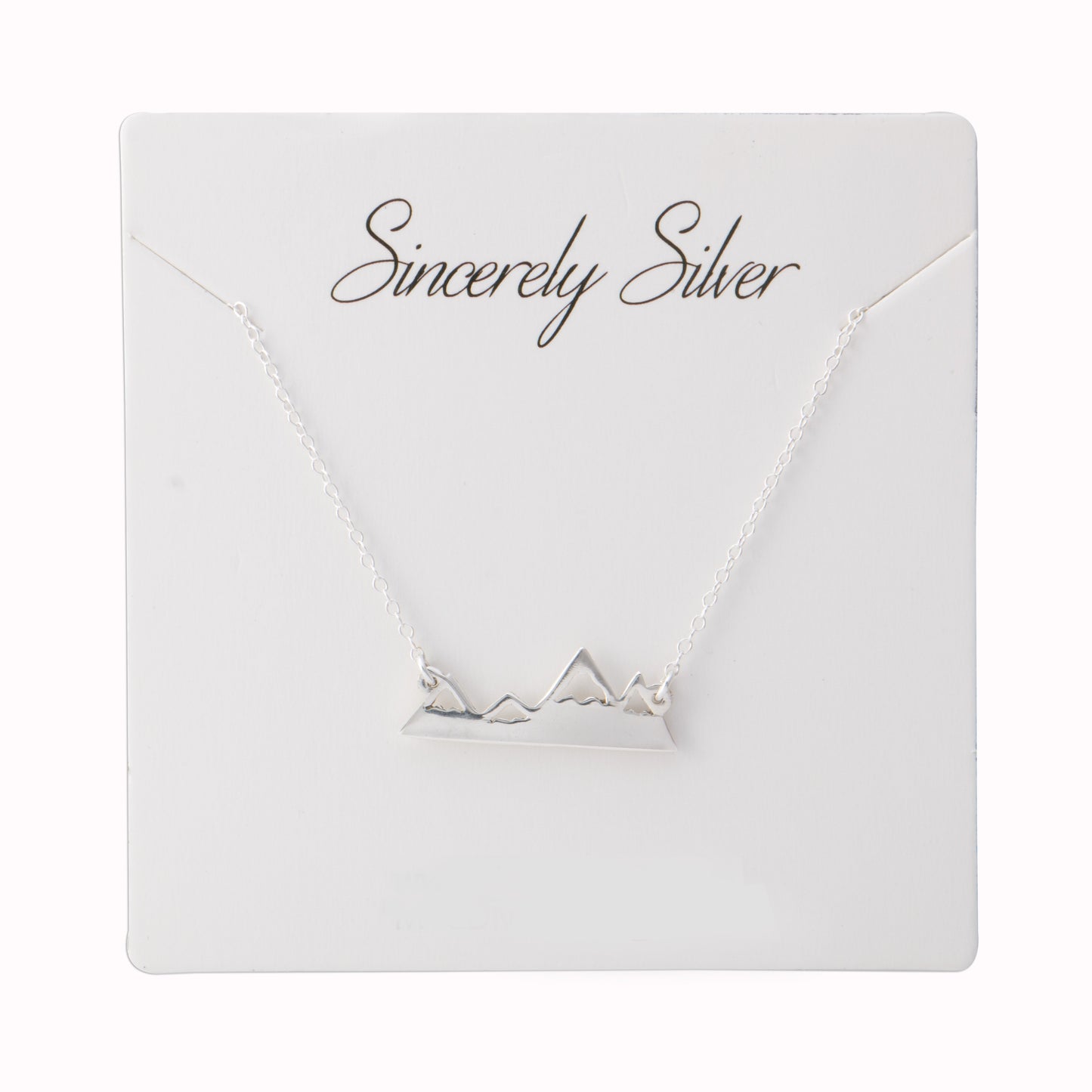 The Sincerely Silver Mountain Range Necklace features a minimalist pendant of a mountain range on a delicate silver chain.