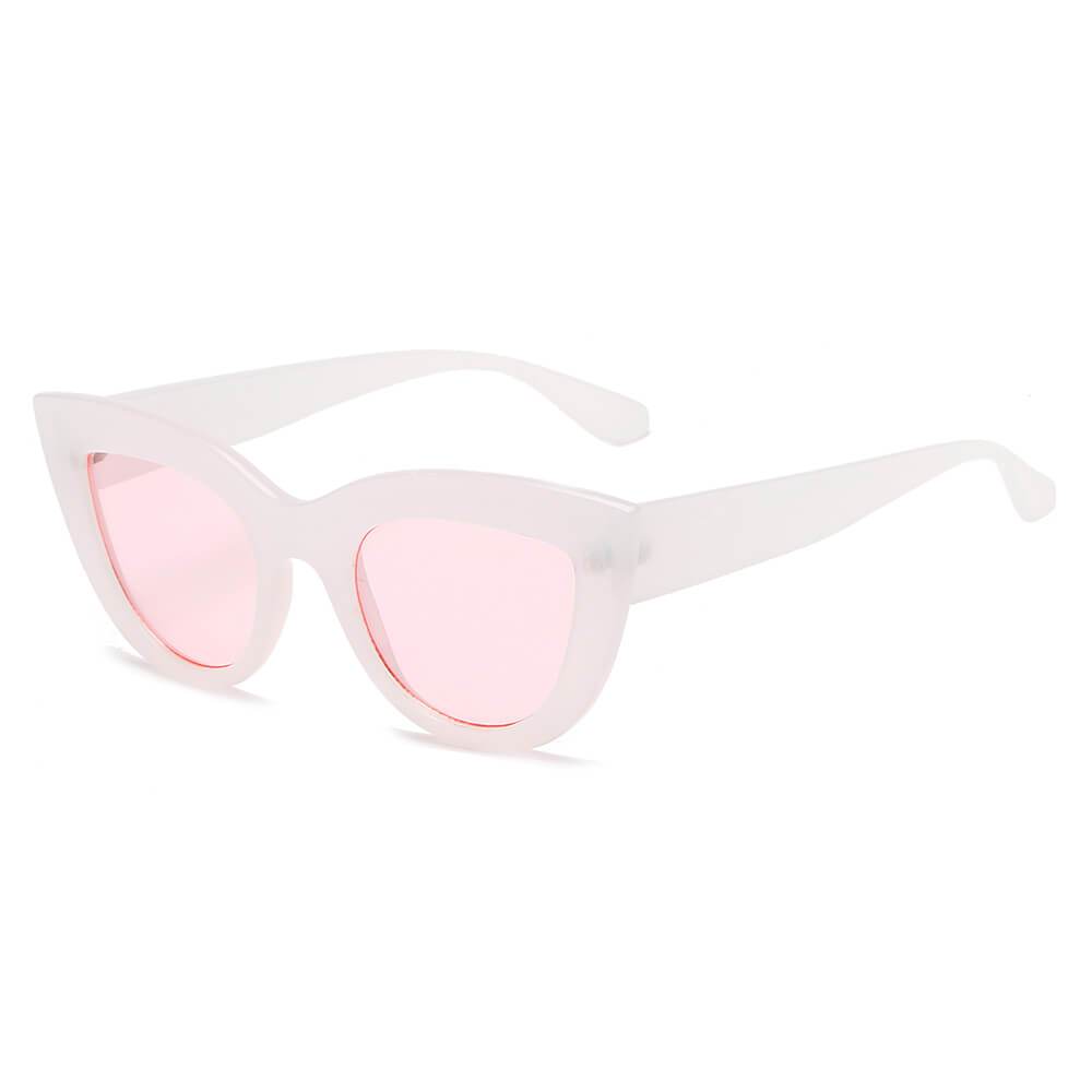 BOYDS women’s round cat-eye sunglasses by Cramilo Eyewear feature pink glittery frames and dark lenses on a white background.