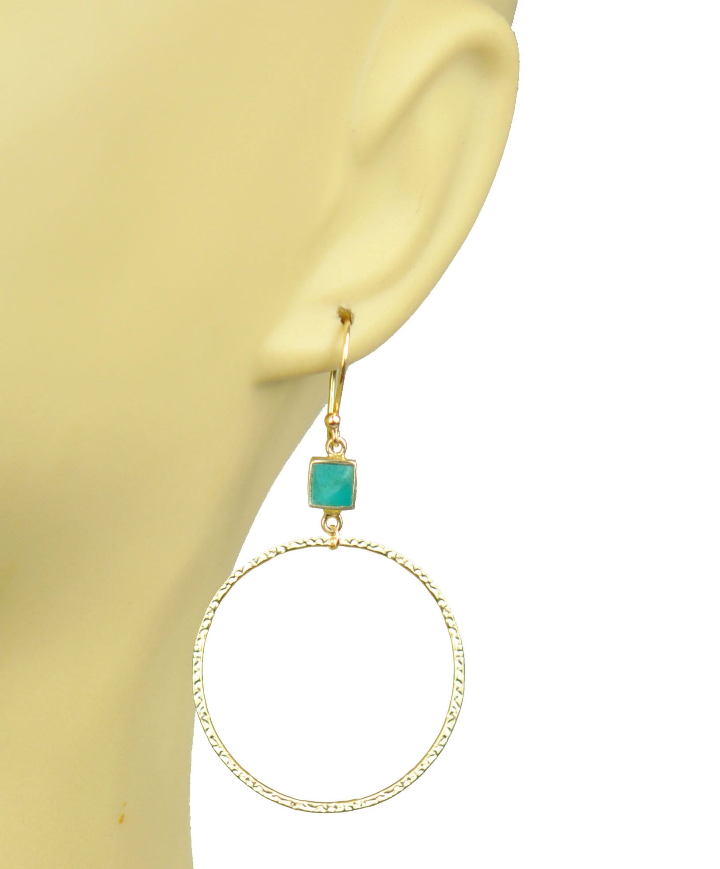 Gold hoop earrings featuring turquoise bezel accents on hooks by Gena Myint.