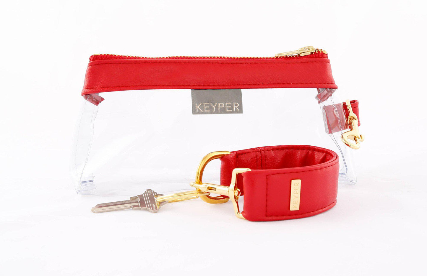 A red vegan leather wristlet set from KEYPER, featuring a gold zipper and detachable strap with gold hardware.