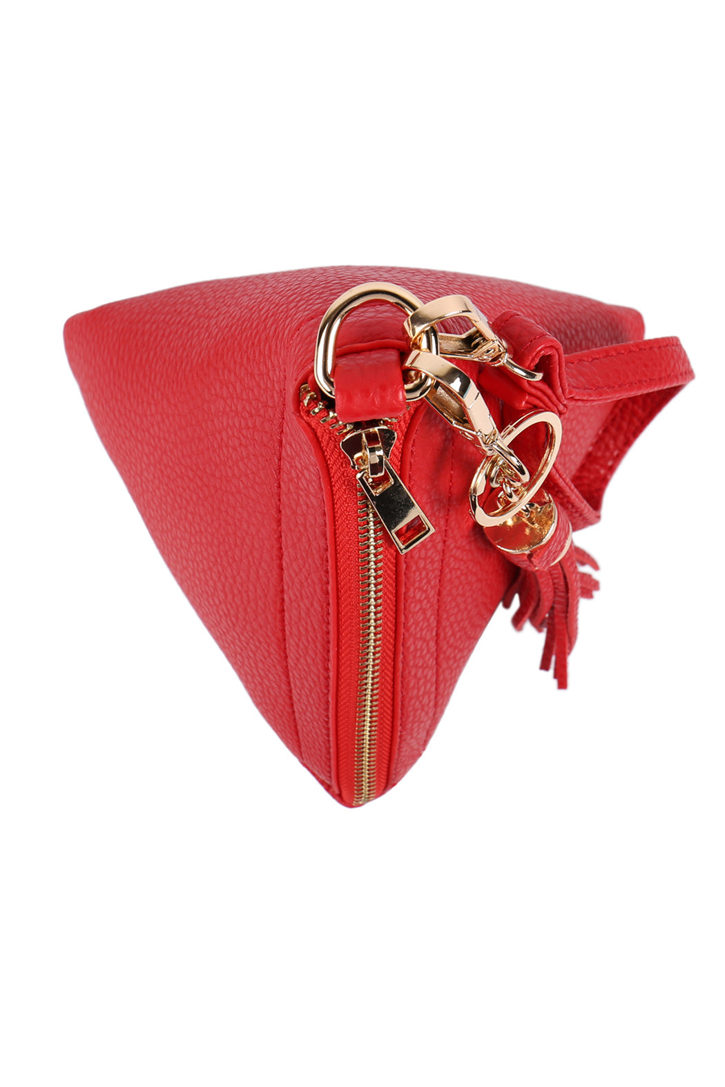 A person in a white shirt and jeans is holding the Riah Fashion Pyramid Shape Tassel Wristlet Leather Bag in orange.