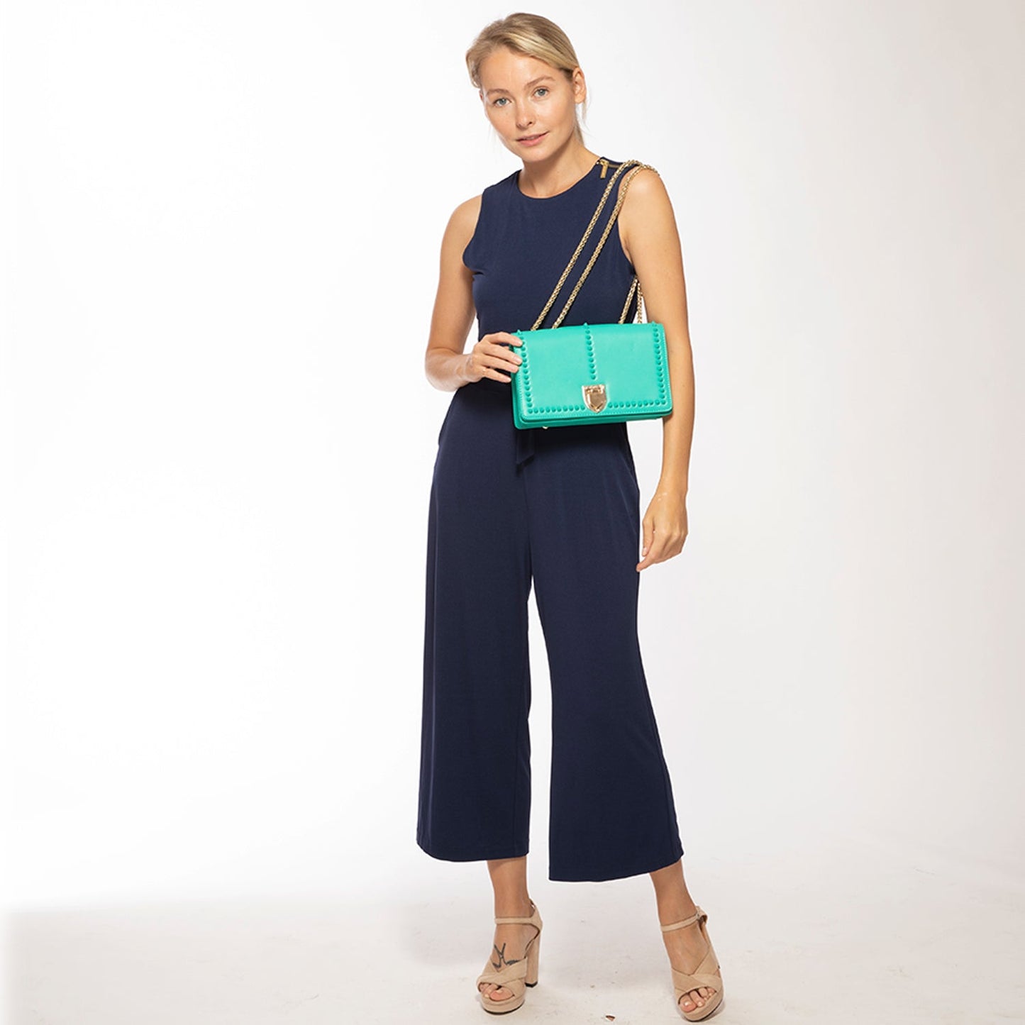 SUSU presents the Josie Green Leather Bag featuring a studded design and a gold chain strap.