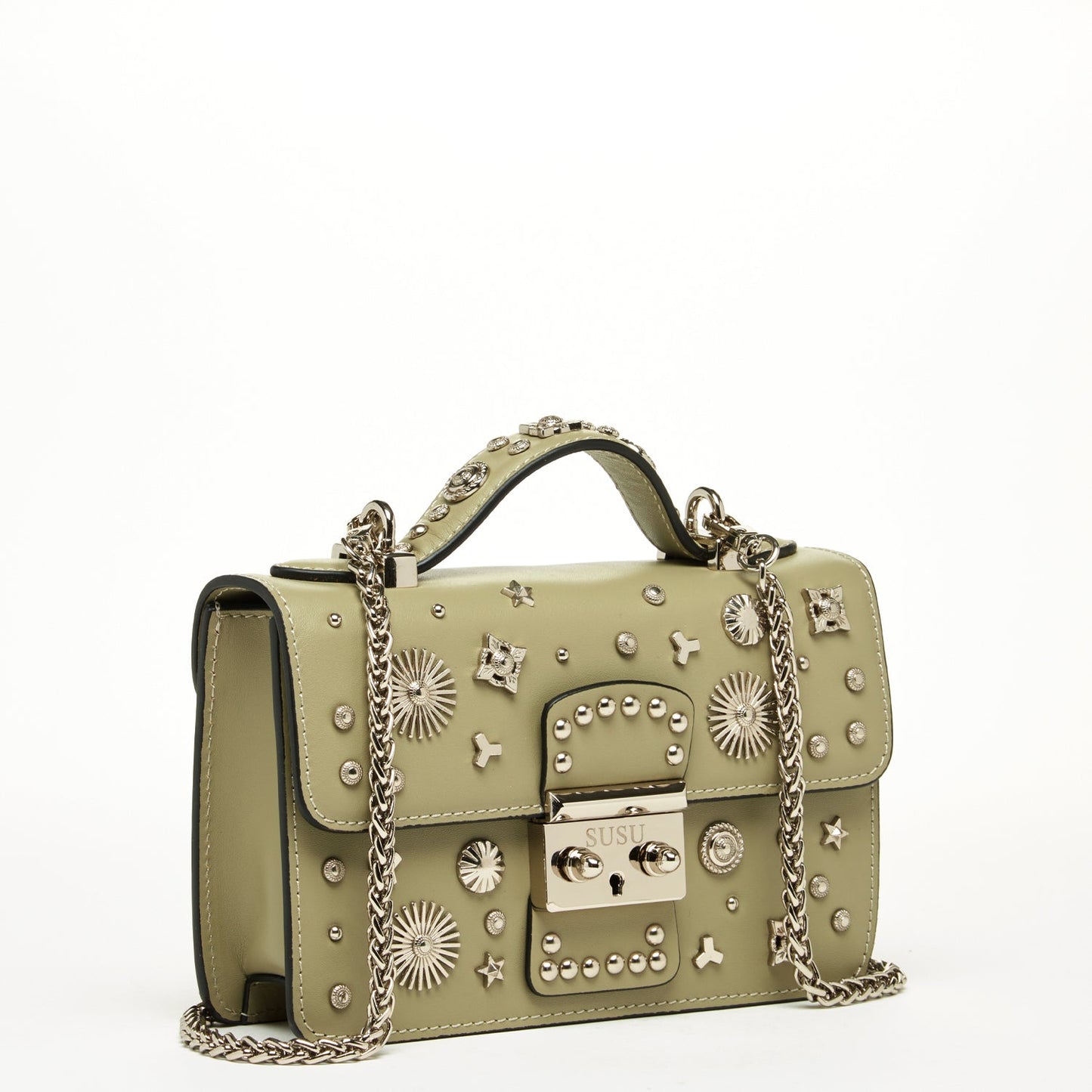 The Hollywood Leather Crossbody Bag by SUSU in sage green features metallic studs and chain straps, elegantly displayed against a plain background.
