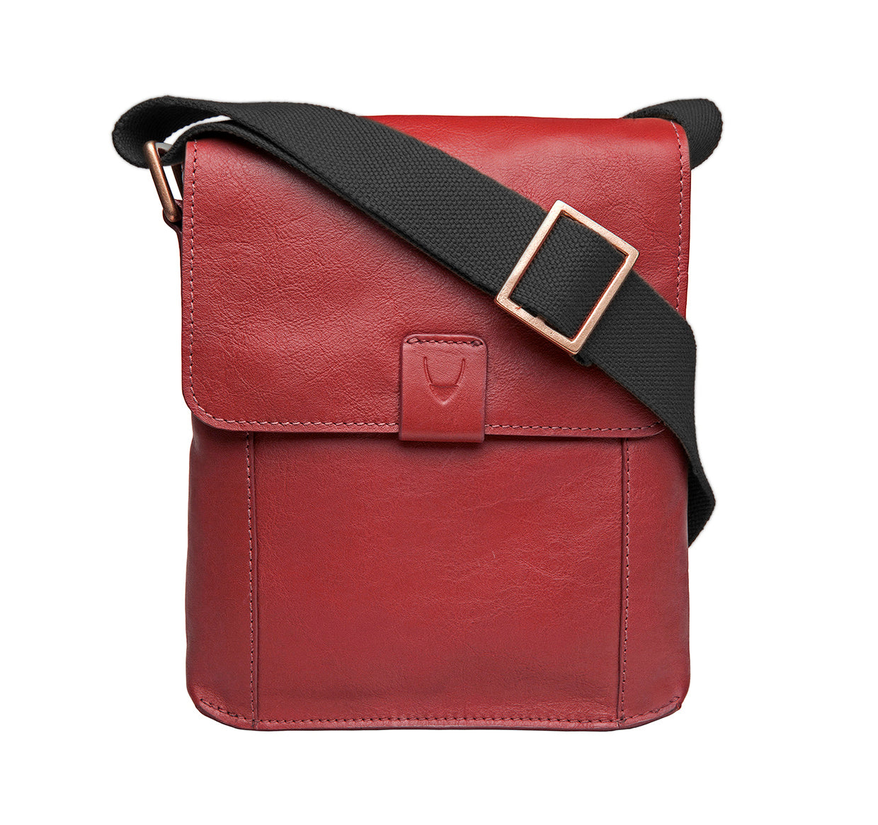 The Aiden Genuine Leather Mini Crossbody by Hidesign is a brown leather shoulder bag featuring a flap cover and an adjustable fabric strap with a brass buckle.
