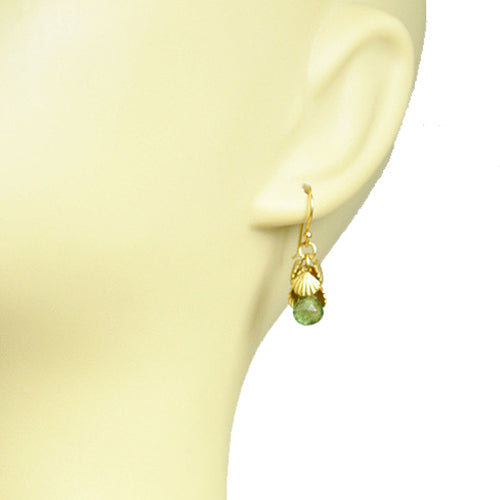 Gena Myints Shell Cluster Peridot earrings feature a leaf-inspired design and green gemstone drops.