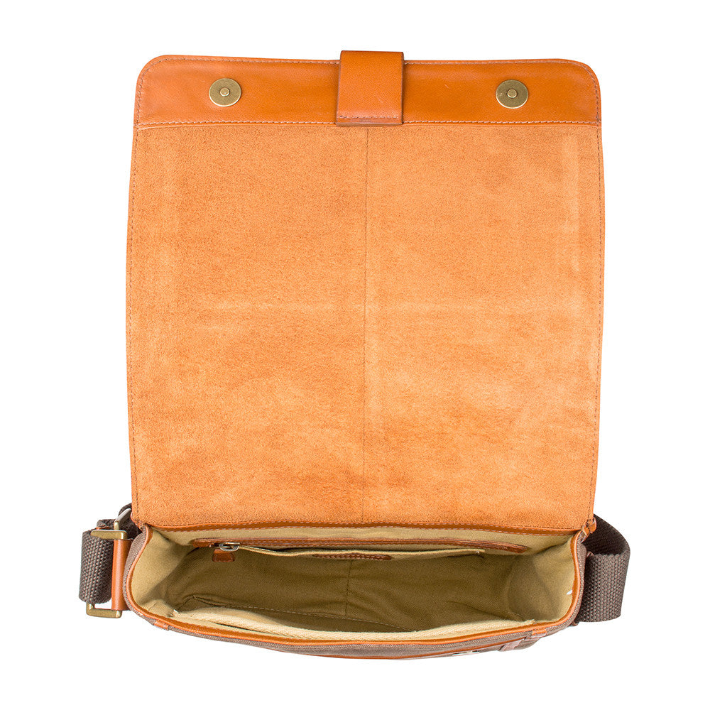 The Aiden Hidesign Blue Genuine Leather and Canvas Crossbody Bag features an adjustable strap and buckle, perfect for men or women as a shoulder, messenger, or travel bag that fits a 10.5 iPad.