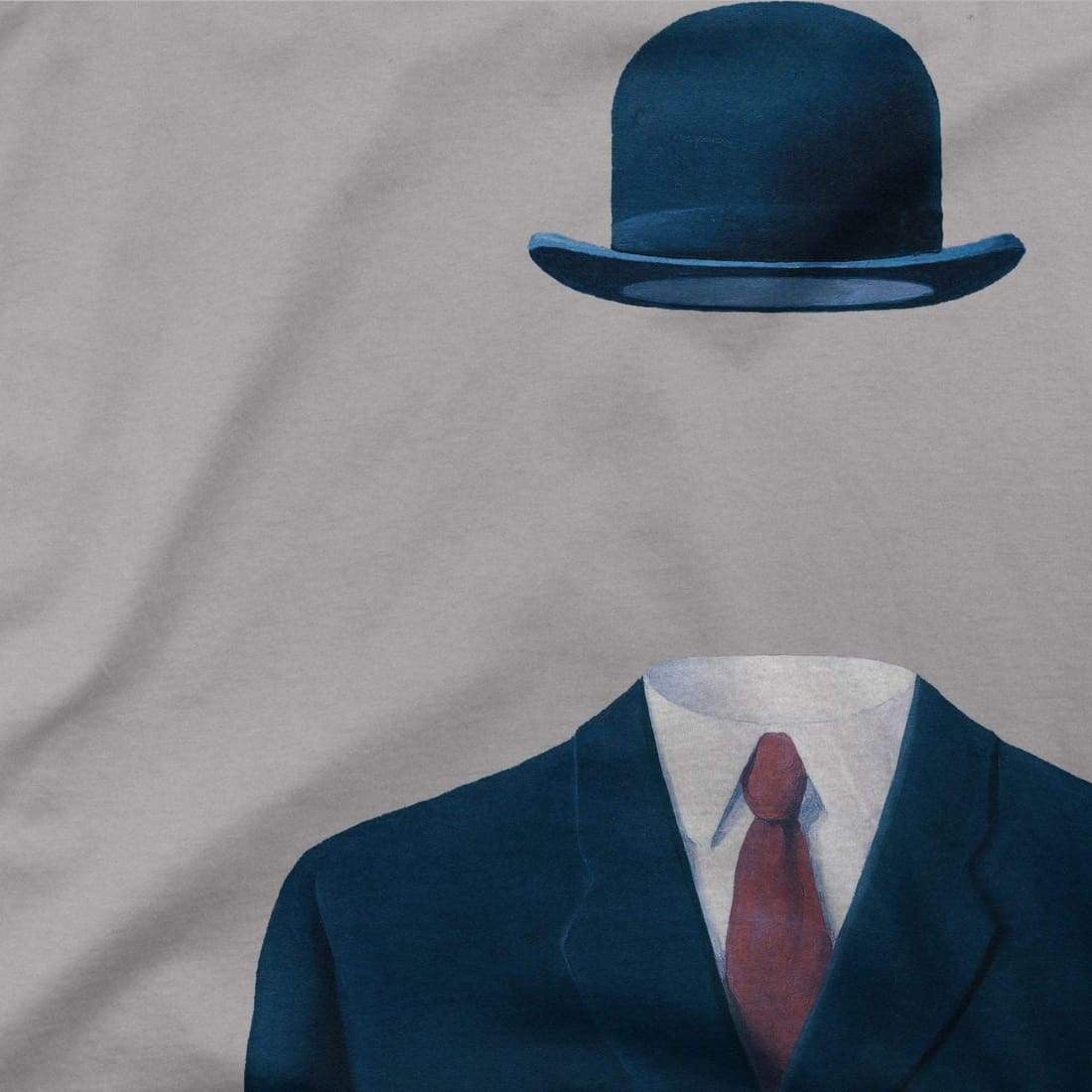 The Art-O-Rama Shops Rene Magritte Man in a Bowler Hat, 1964 Artwork t-shirt in silver features an illustration of a blue suit, tie, and bowler hat with no visible head or body beneath the clothing.