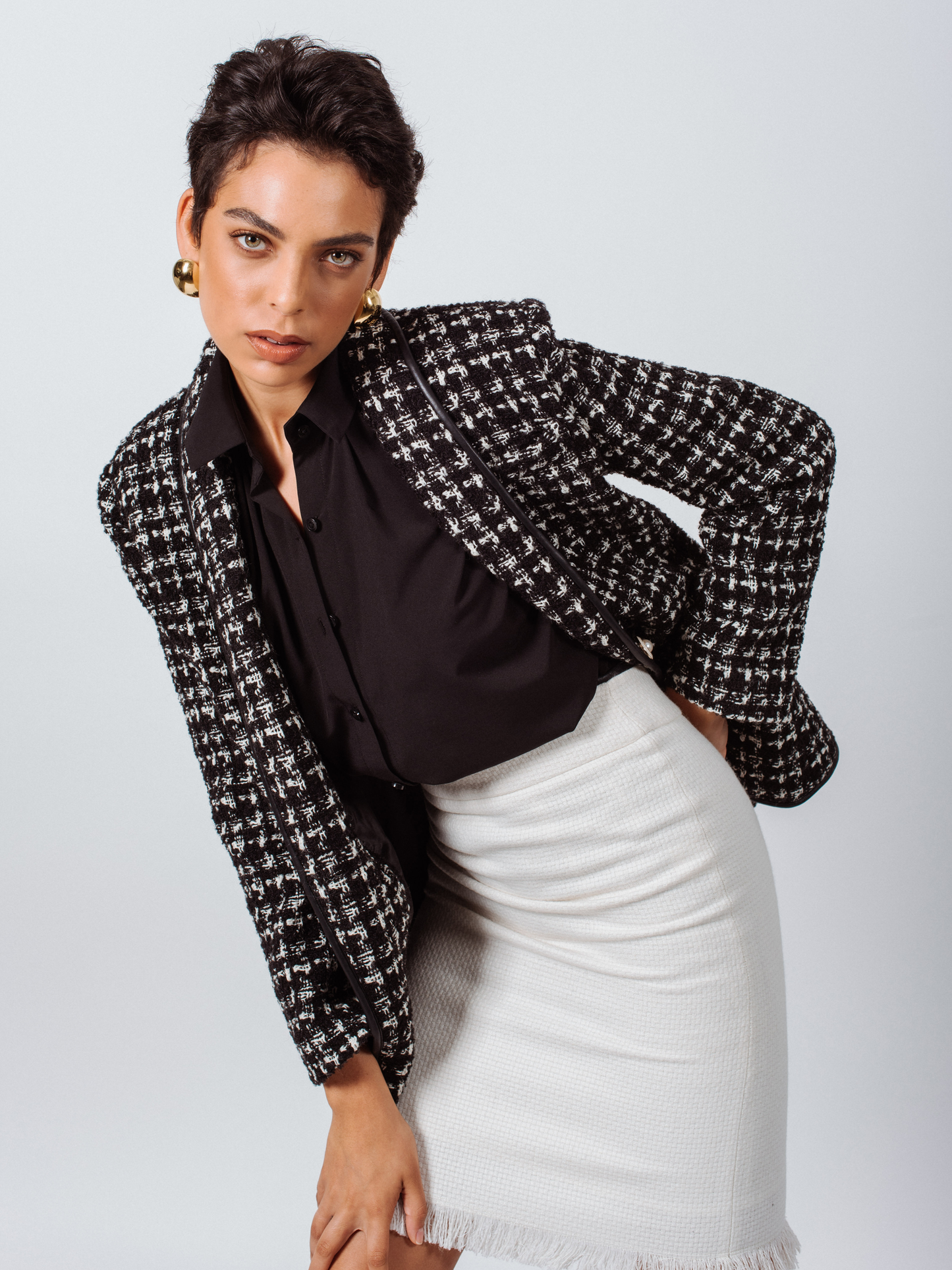 Close-up of Le Réussi®s Power Woman Black & White Tweed Checkers Jacket featuring decorative pearl buttons.
