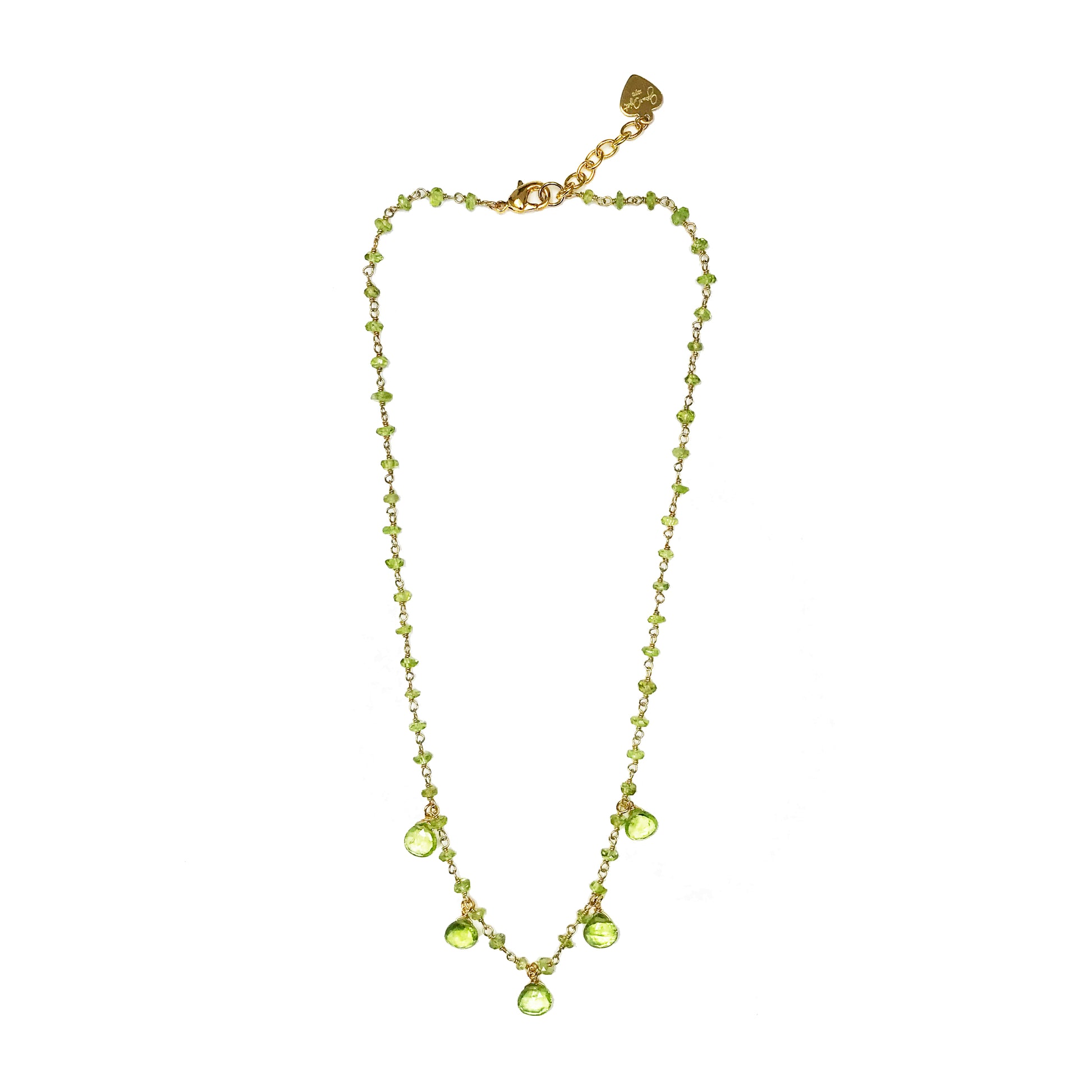 The Gena Myint Peridot Droplet Vermeil Necklace features a gold chain with small green gemstones and five larger teardrop-shaped stones.