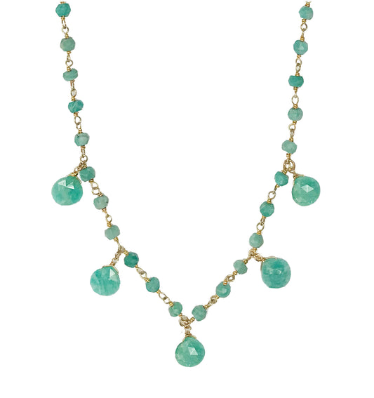 Gena Myints Amazonite Droplet Vermeil Necklace features a gold chain adorned with turquoise beads and teardrop pendants.