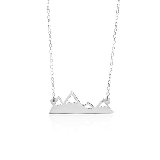 The Sincerely Silver Mountain Range Necklace features a minimalist pendant of a mountain range on a delicate silver chain.