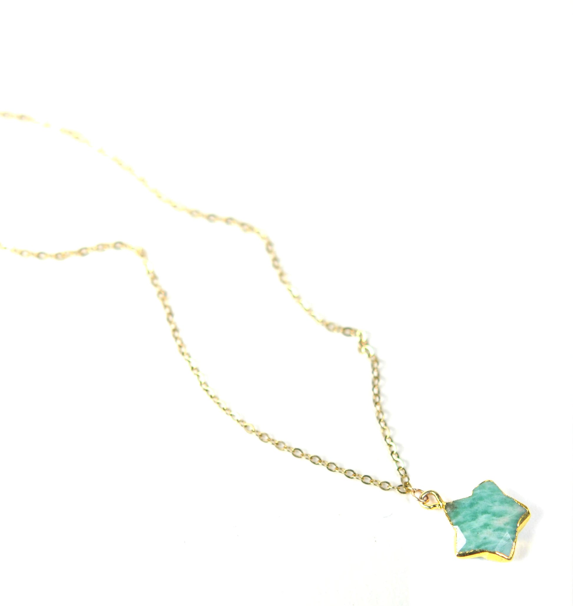 Gena Myints Amazonite Star Necklace featuring a gold chain and a star-shaped turquoise pendant.