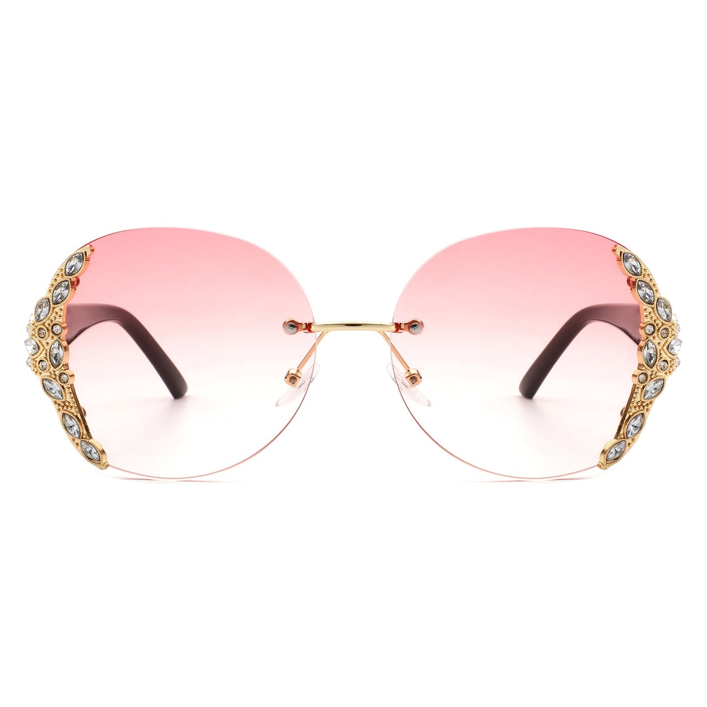 Stylish black sunglasses with oval rimless frames, pink gradient lenses, ornate gold detailing, and rhinestone design by Cramilo Eyewear.