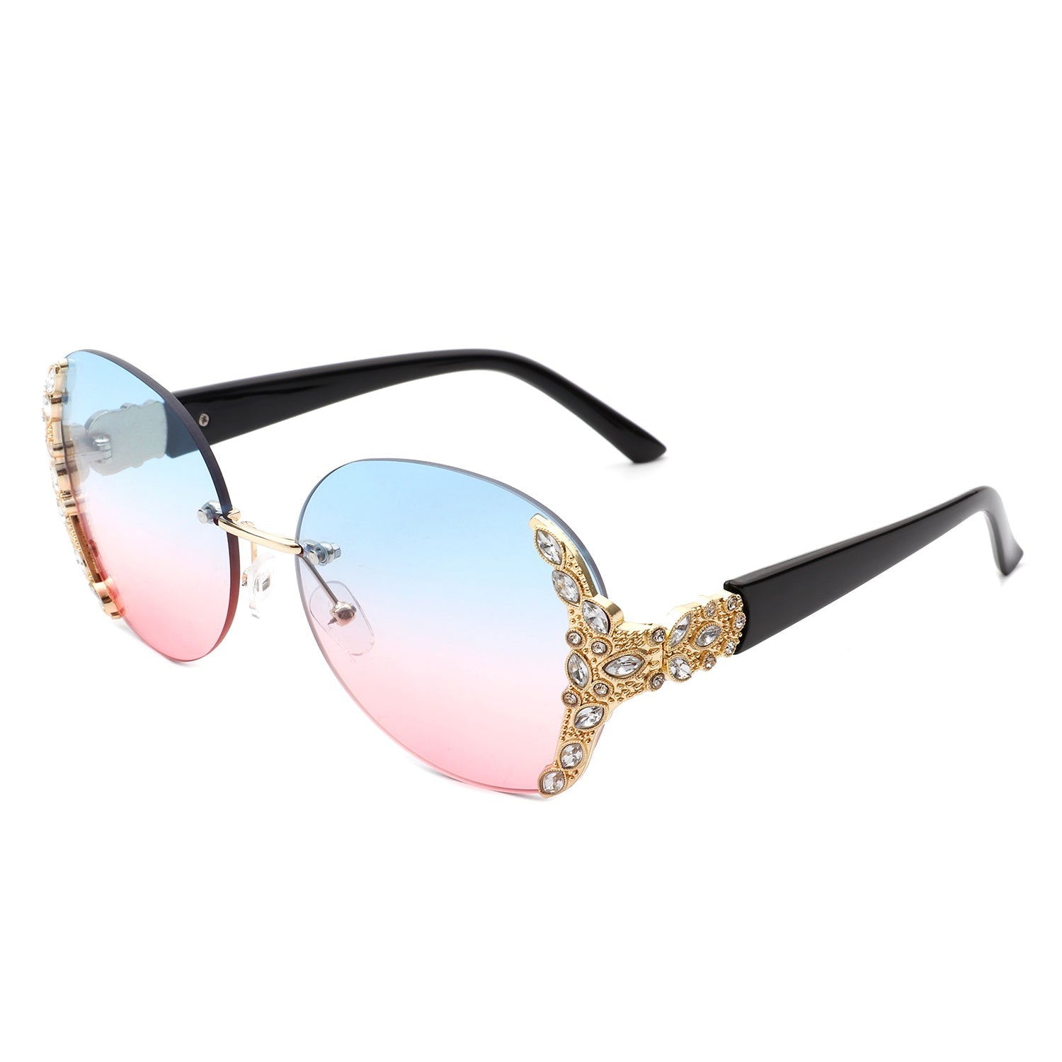 Stylish black sunglasses with oval rimless frames, pink gradient lenses, ornate gold detailing, and rhinestone design by Cramilo Eyewear.