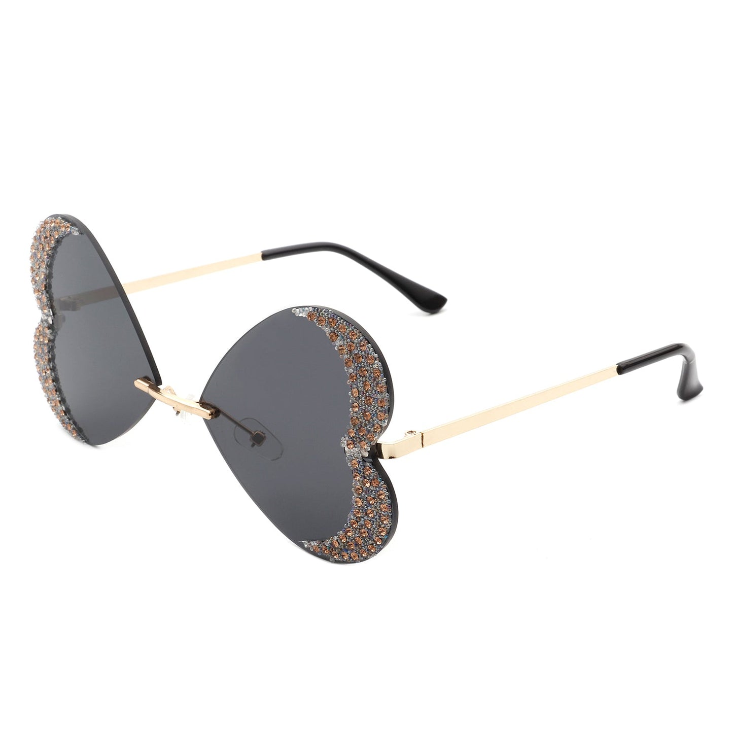 The Quixotia - Rimless Butterfly Heart Shape Tinted Fashion Women Sunglasses by Cramilo Eyewear are heart-shaped with purple lenses and golden arms, adorned with rhinestones along the edges.