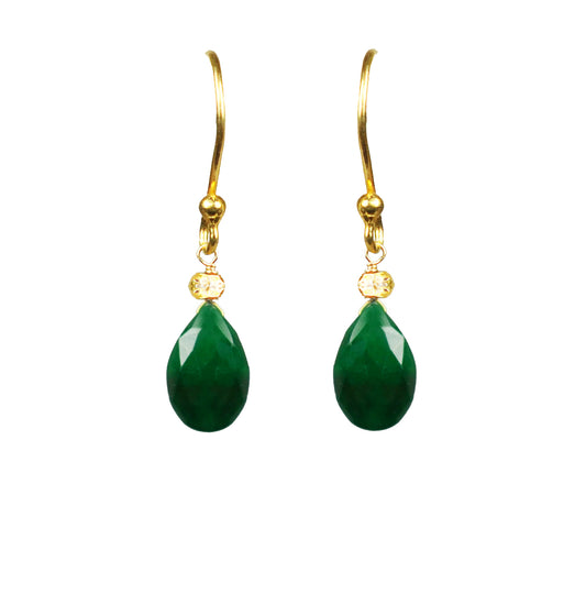 The Emerald Drop Vermeil Earrings by Gena Myint feature gold hooks with green teardrop-shaped gemstones and small clear stones above them.