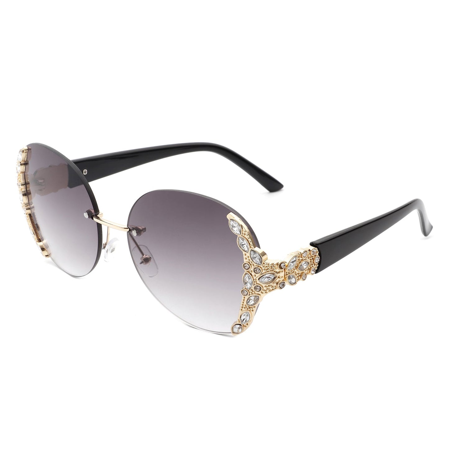 Stylish black sunglasses with oval rimless frames, pink gradient lenses, ornate gold detailing, and rhinestone design by Cramilo Eyewear.